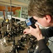 A research assistant at the the German National Metrology Institute studies an atomic clock